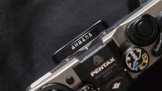 Close up of the focus zone markings on a Pentax 17 film camera