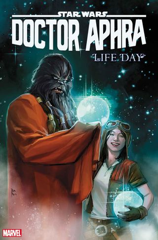 chewbacca wearing an orange robe, holds a glowing crystalline sphere while a girl wearing aviator goggles smiles in the background.