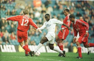 Tony Yeboah of Leeds takes on the Liverpool defence during the Leeds United v Liverpool FA Cup Quarter Final match at Elland Road, Leeds.
