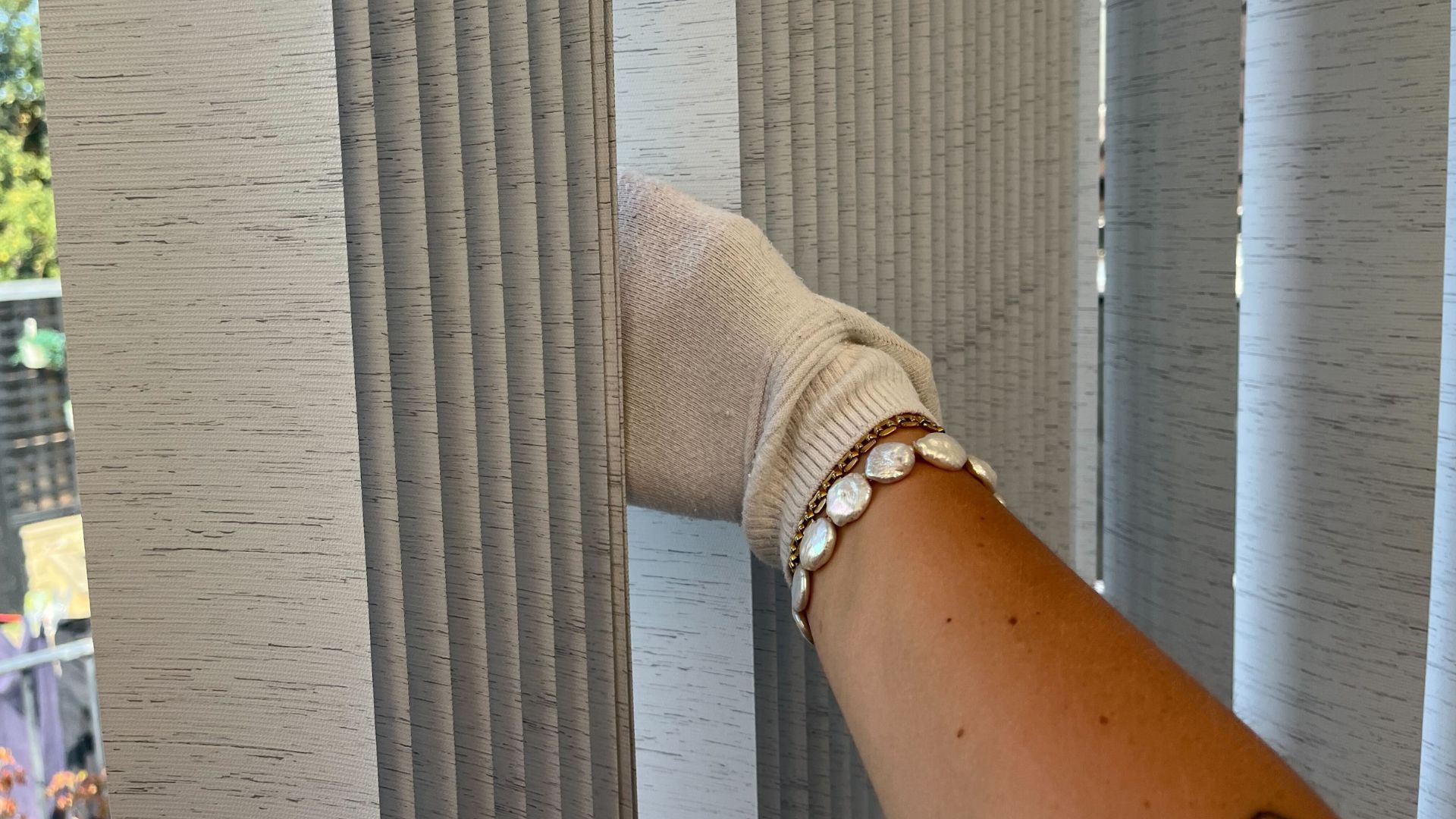 picture of me wiping blind with sock on my hand
