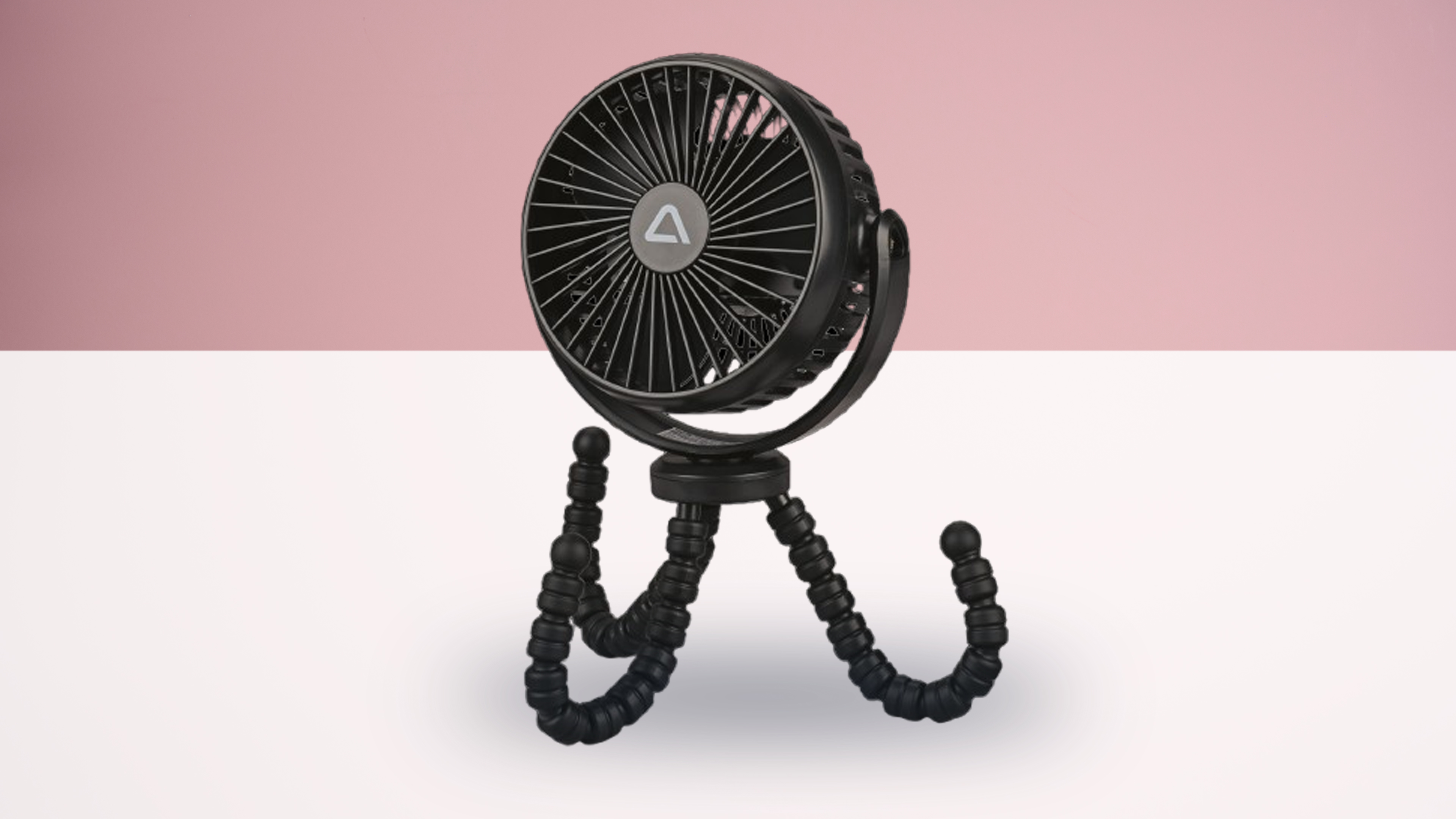 Aldi tripod fan on white and pink background