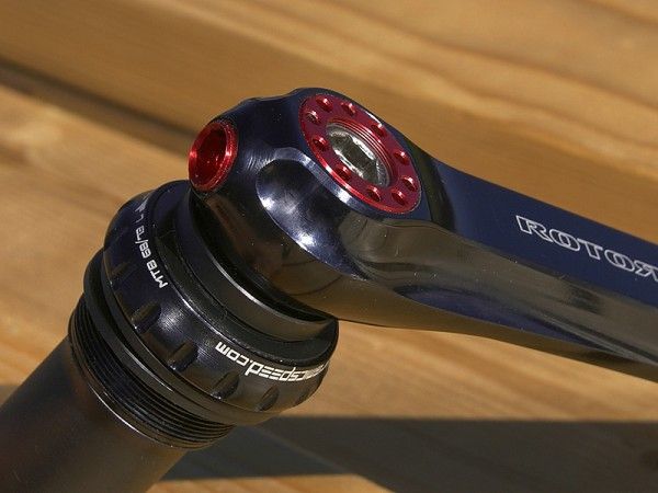 The non-drive arm attachment is adjustable for precise bearing preload.