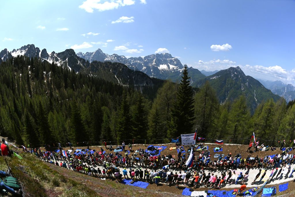MONTE LUSSARI ITALY MAY 27 Lukas Pstlberger of Austria and Team Jayco AlUla sprints while fans cheer during the 106th Giro dItalia 2023 Stage 20 a 186km individual climbing time trial stage from Tarvisio 750m to Monte Lussari 1744m UCIWT on May 27 2023 in Monte Lussari Italy Photo by Tim de WaeleGetty Images