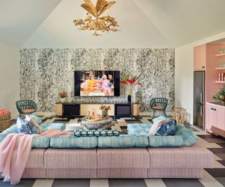 poolhouse living room with pink kitchen and sofa