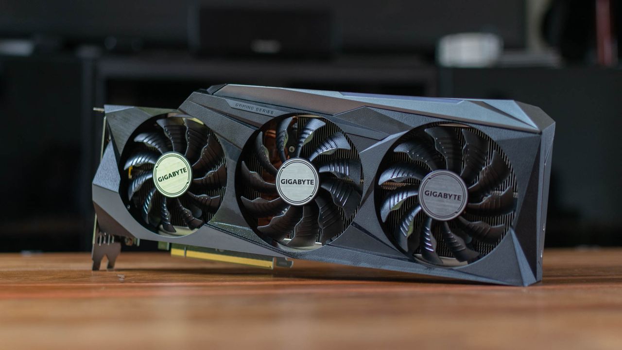 A photograph of the Gigabyte GeForce RTX 3090 GAMING OC 24G stood on its side on a table
