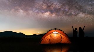 how to stay warm in a tent: tent and bright night sky