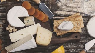 Cheese board, with cow's milk cheeses like brie, crackers and dried fruits