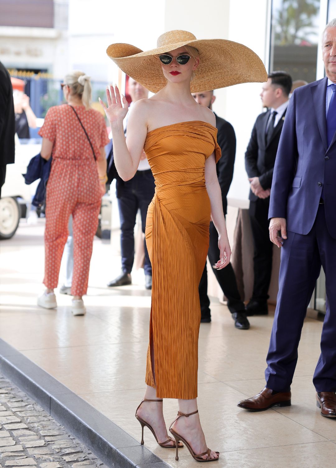 Anya Taylor-Joy wearing an oversized sun hat