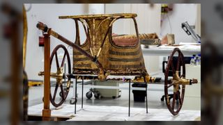 The golden chariot found in King Tutankhamun's tomb. In this 2019 photo, the chariot is awaiting restoration at the Grand Egyptian Museum in Giza.
