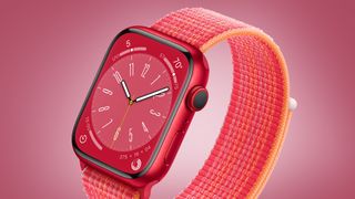 A pink Apple Watch 8 on a red background