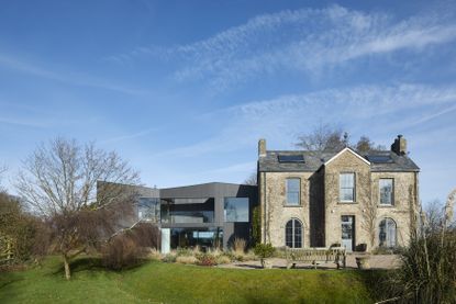 Hero exterior of house on the hill on a sunny day