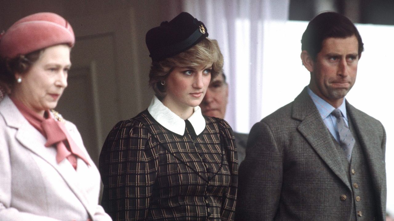 Queen Elizabeth Ll With Princess Diana And Prince Charles Watching The Traditional Highland Games At Braemar