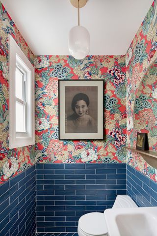 a small wallpapered bathroom