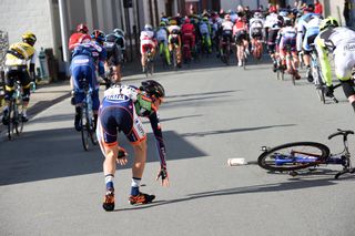 Yuma Koishi crashes during Kuurne-Brussels-Kuurne on Sunday, but quickly gets himself back up and into the saddle.