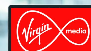 A laptop screen showing the Virgin Media logo