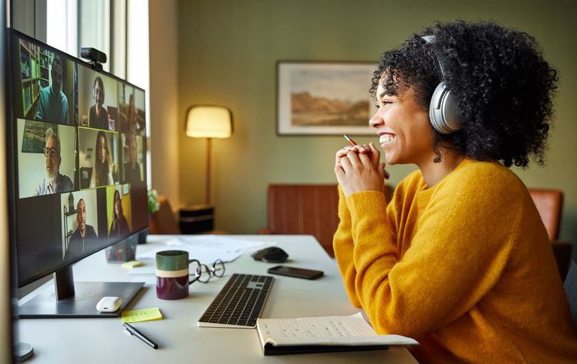 Woman smiling at computer