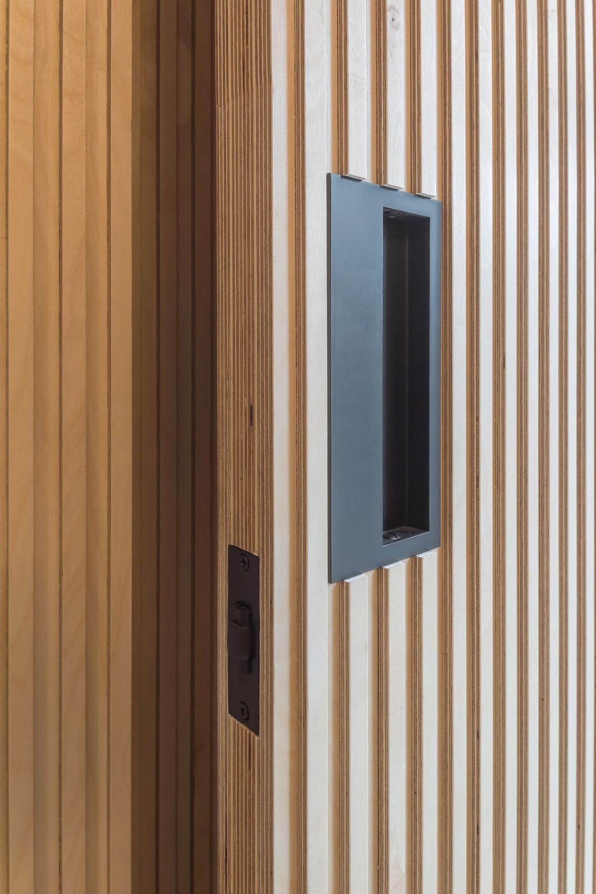 A close up shot of a wood clad fire door