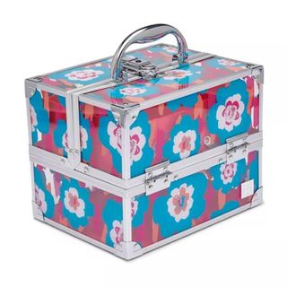 A makeup box in pink, blue, and white features a retro flower design