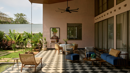 beautiful covered patio with checkerboard flooring and comfortable seating areas