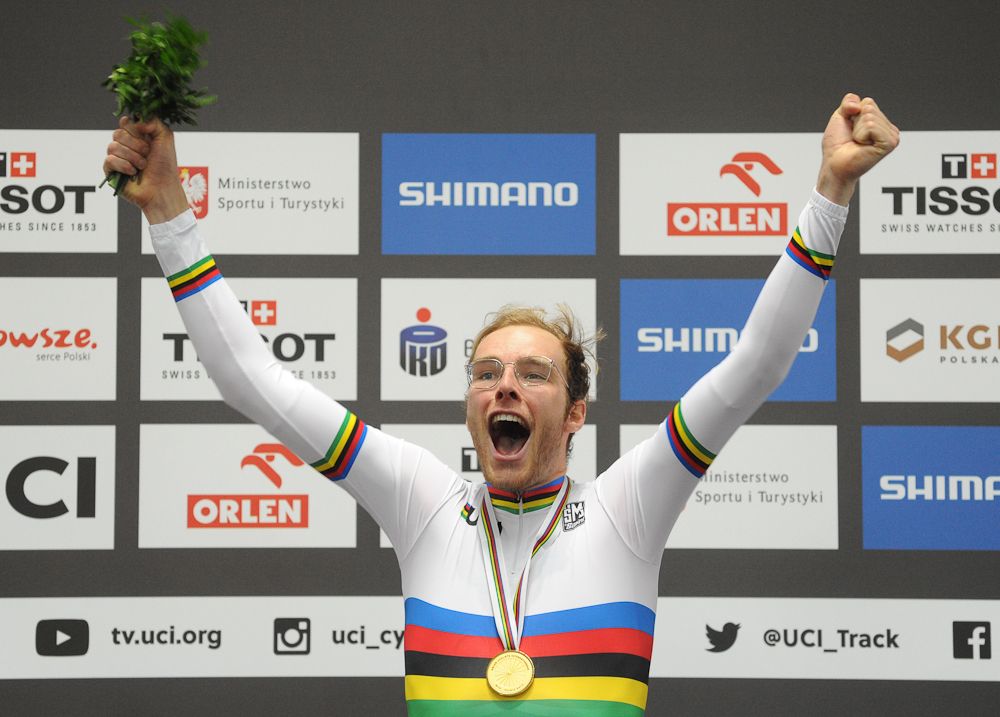 The winner from The Netherlands Jan-Willem van Schip celebrates on the podium after the Men's Points Race