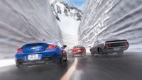 An official screenshot of Forza Horizon 6 showing cars racing between massive snowbanks.