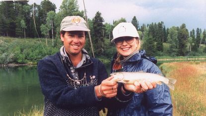 Hilary Clinton holding a fish