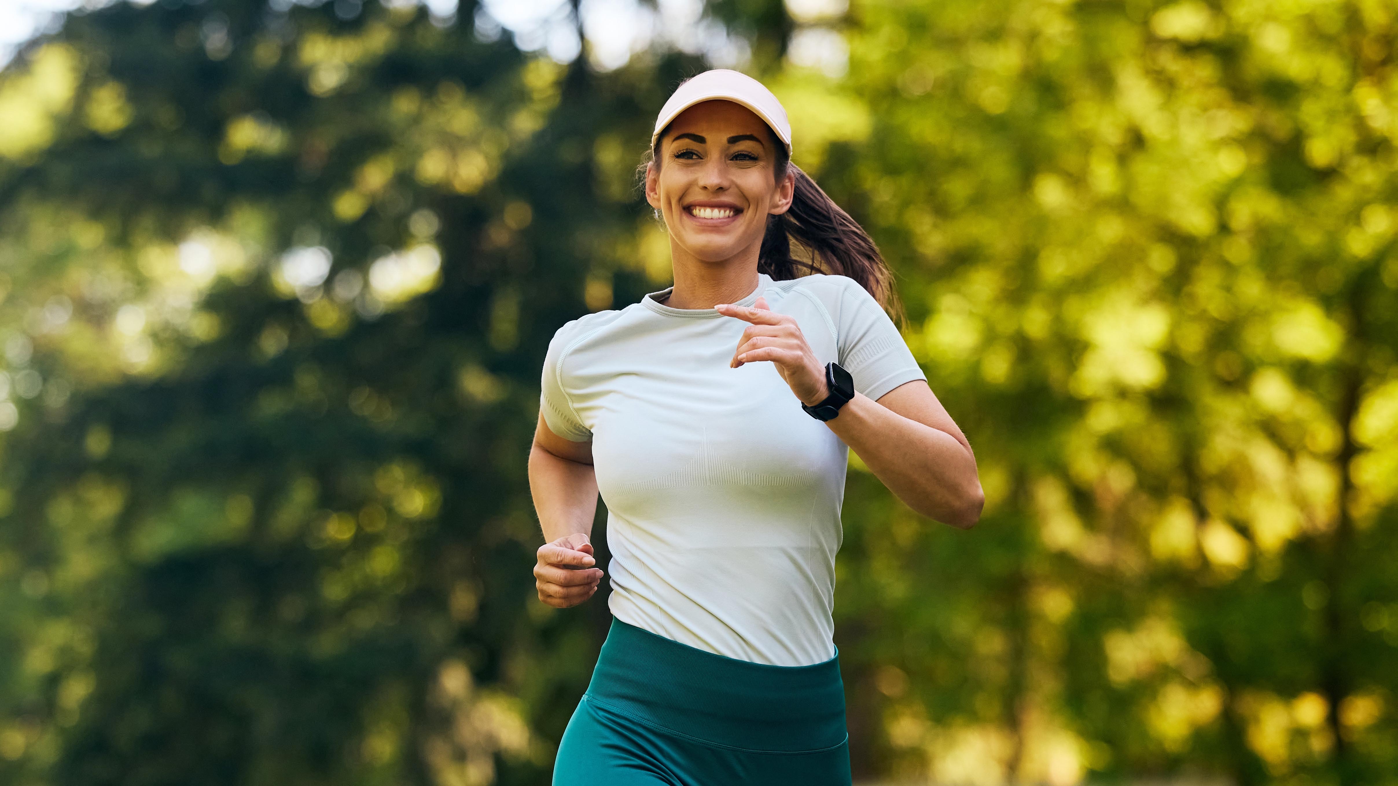 a woman running and smiling