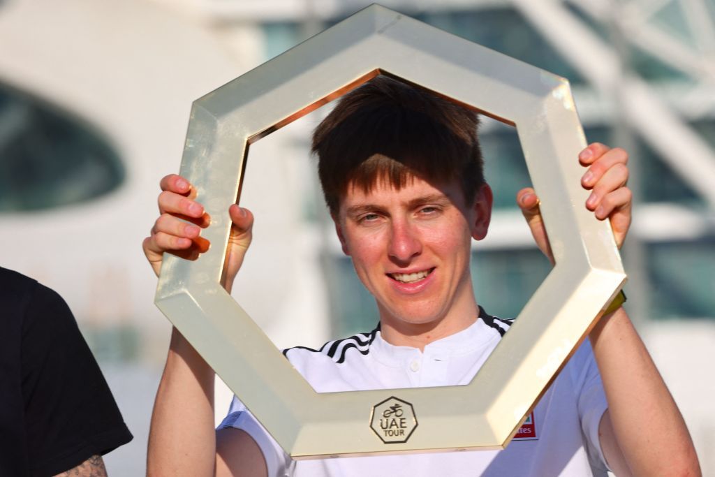 Slovenias Tadej Pogacar poses for a picture with the trophy on the eve of the UAE cycling tour on February 19 2022 at Yas Marina Circuit in Abu Dhabi The twotime Tour de France champion is in upbeat mood ahead of cyclings first big race of the season which for his UAE Emirates Team is a home race the UAE Tour Photo by GIUSEPPE CACACE AFP Photo by GIUSEPPE CACACEAFP via Getty Images