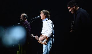 (from left) Krist Novoselic, Paul McCartney and Pat Smear perform onstage at Madison Square Garden in New York City on December 12, 2012
