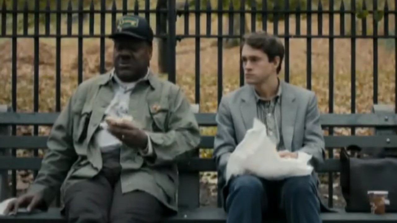Frankie Faison sitting on a park bench with Hugh Dancy in Adam
