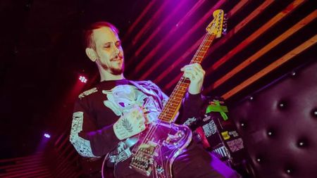 Filth Is Eternal guitarist Brian McClelland plays guitar onstage