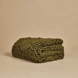 Green chunky cable knit throw