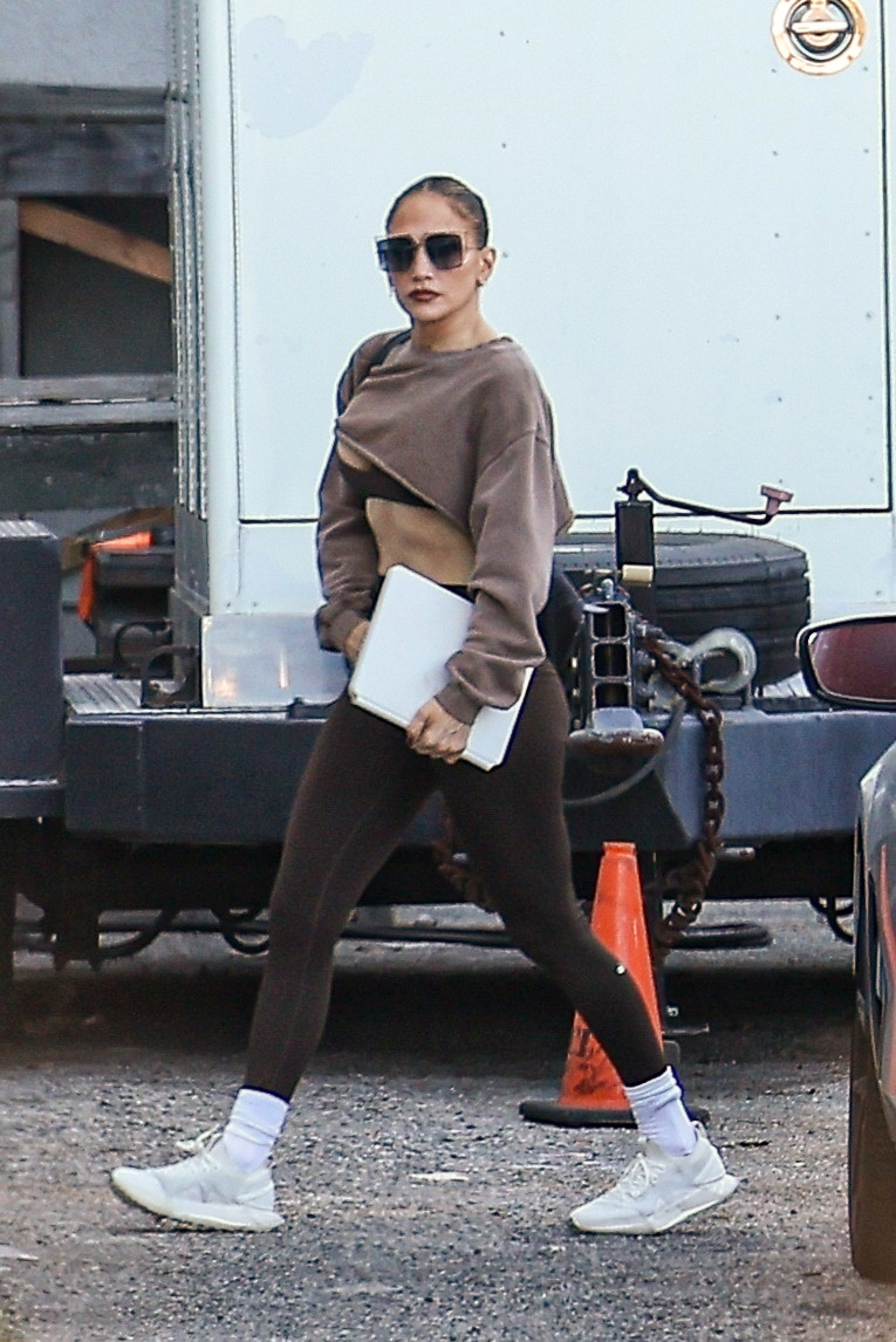Jennifer Lopez swapped her black leggings for a brown pair, a matching sweatshirt, and white sneakers