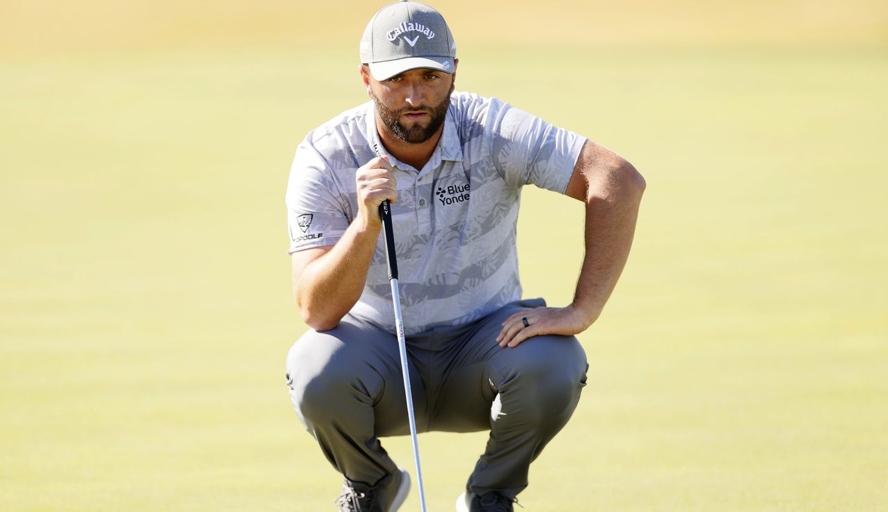 Rahm lines up a putt