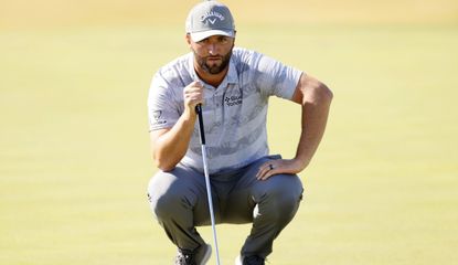 Rahm lines up a putt