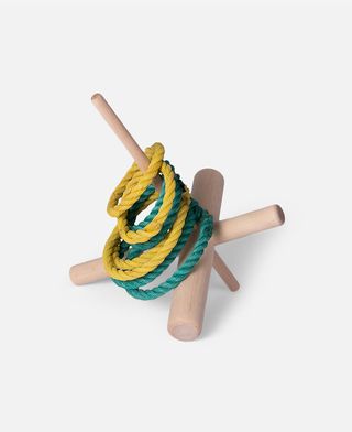 Wooden ring toss toy by Adrien Rovero