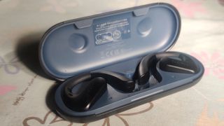 The OpenRock S's open case with the buds inside.