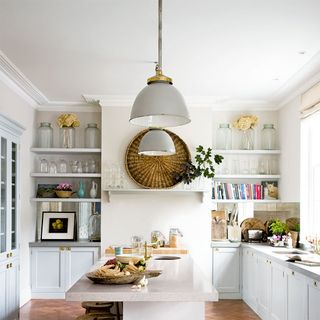 kitchen with white worktop and pendant lights