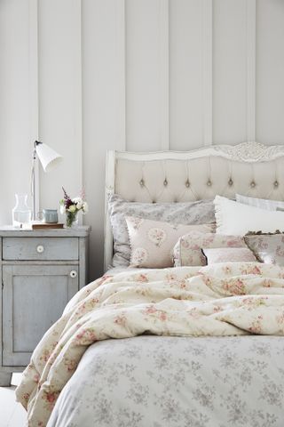 Simple french style room with floral bedding and french bed