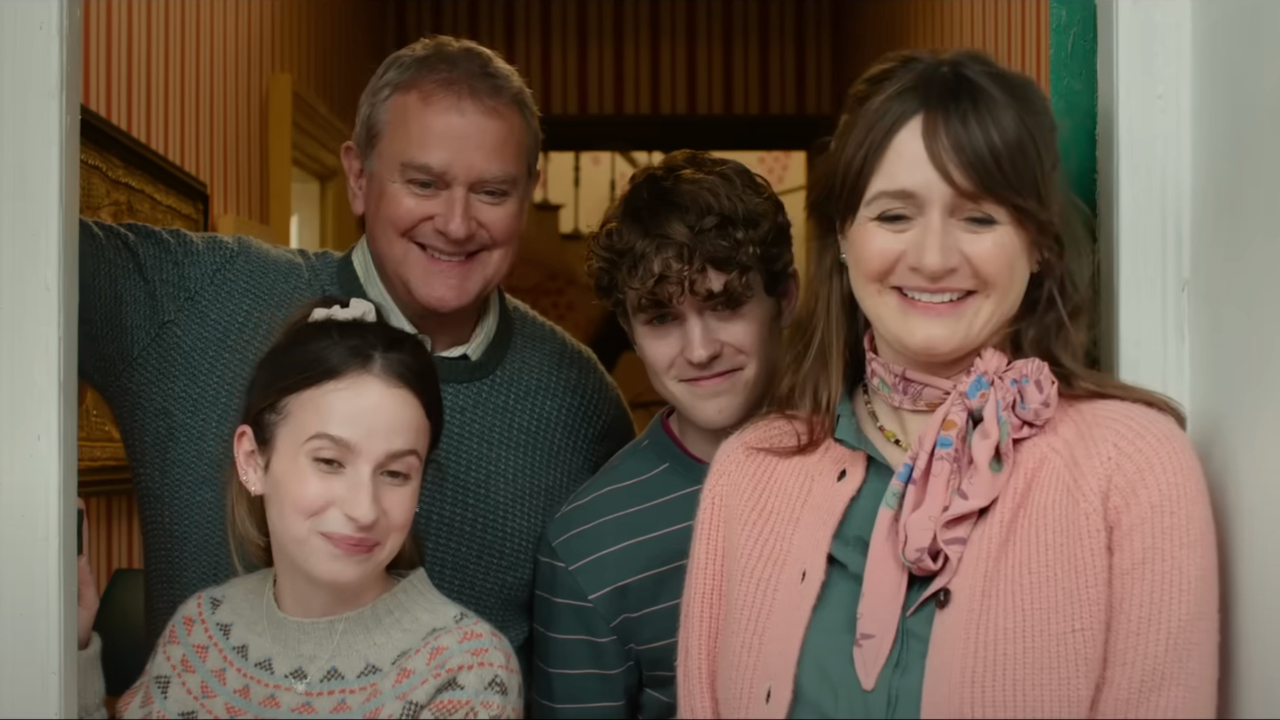 The brown family is smiling in their door in Paddington in Peru.