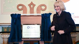 Camilla, Queen Consort unveils a plaque during the visit to the Royal Osteoporosis Society reception