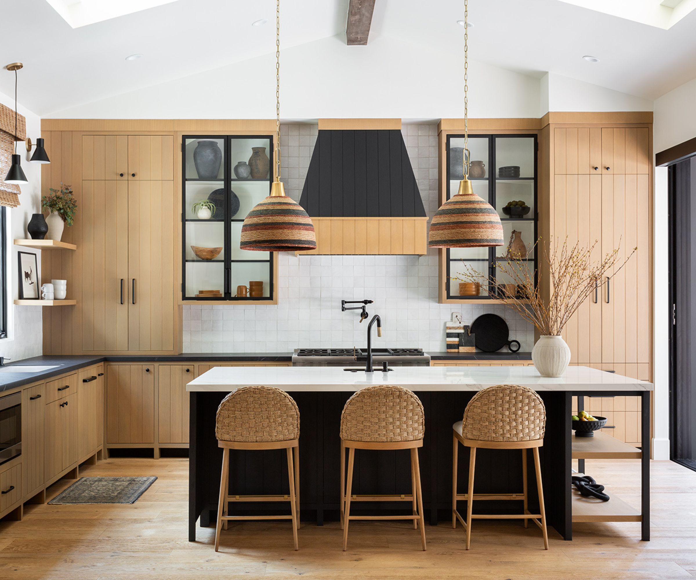kitchen with pale wood units and dark details