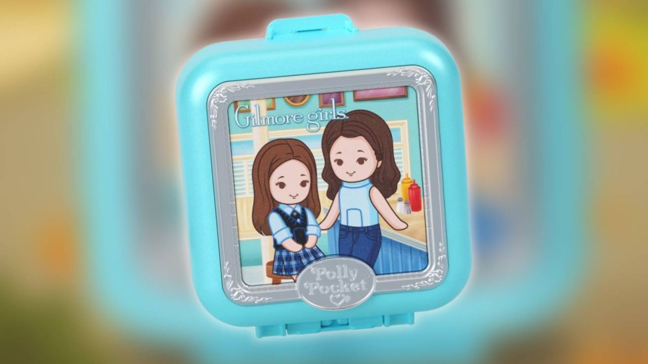 Image of the Gilmore Girls Polly Pocket compact on a blurred background.