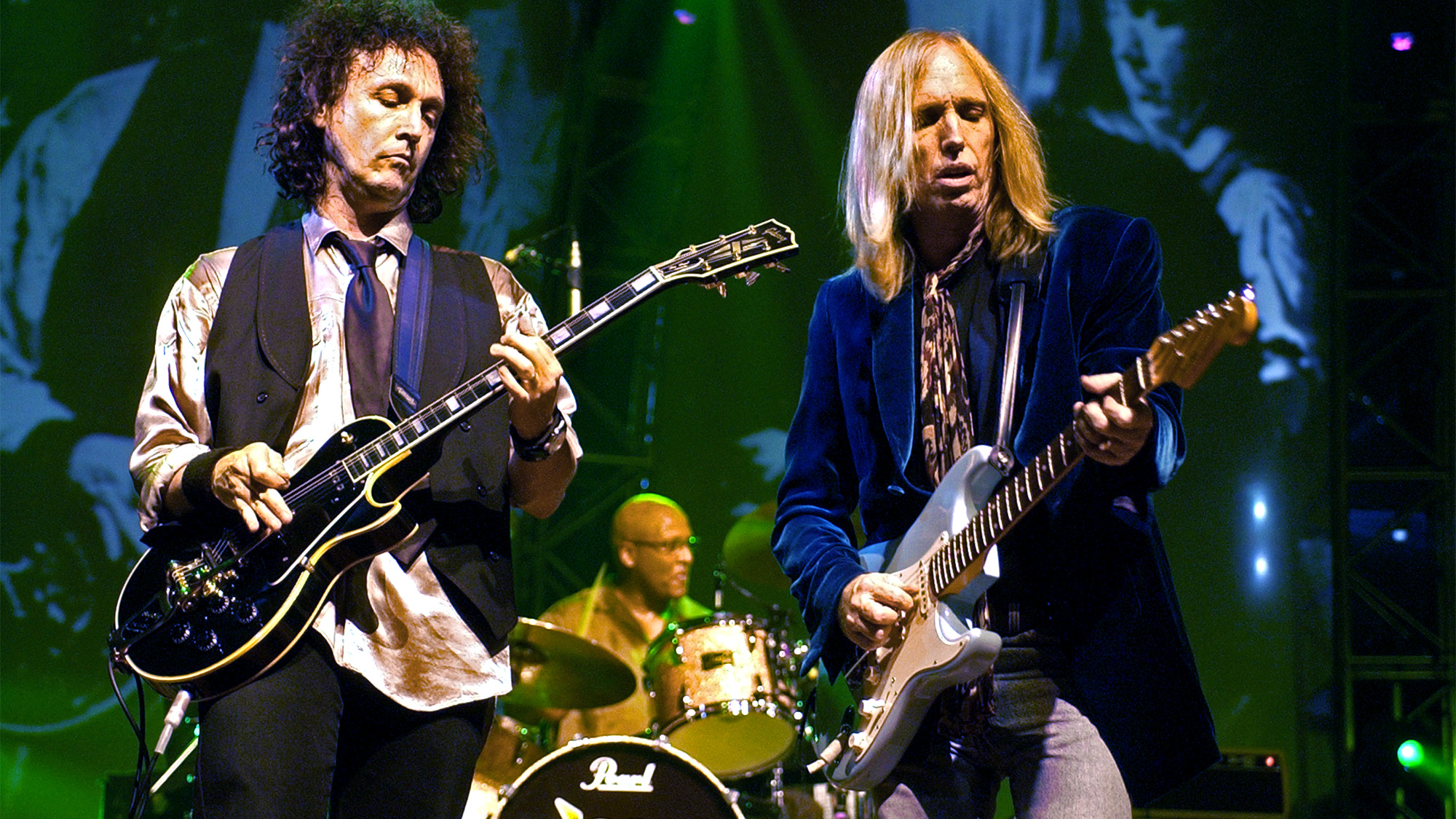 Mike Campbell & Tom Petty during Tom Petty and the Heartbreakers Tour 2002 - Los Angeles at The Forum in Los Angeles, California, United States.