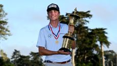 Mason Howell poses with the US Amateur trophy after winning in 2025