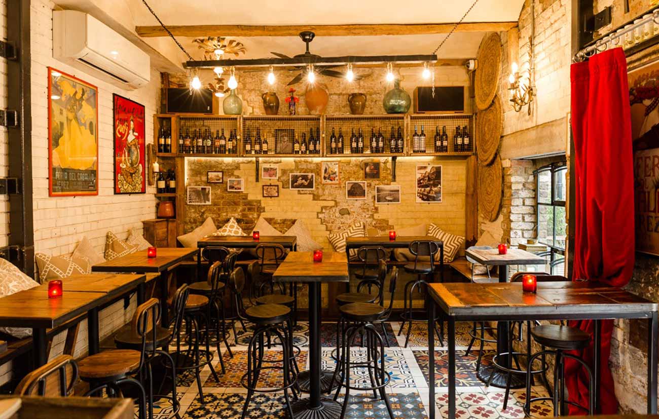 A wine bar with tables and chairs