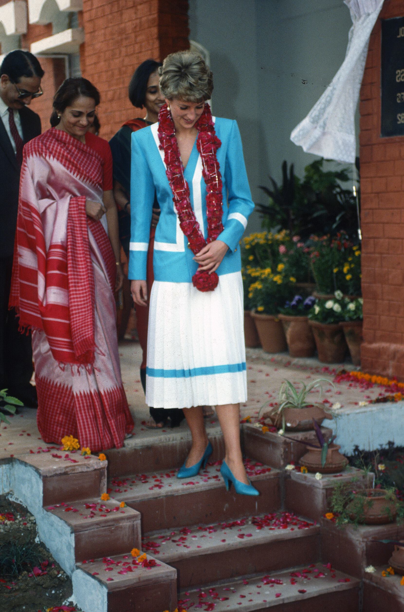 Princess Diana wearing a turquoise and white suit by Catherine Walker during a visit to Tamana Special School in New Delhi on February 12, 1992