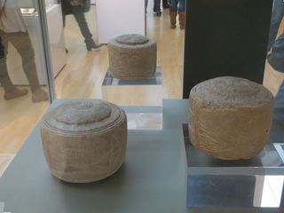 The Folkton drums were found in a prehistoric child's grave in the north of England more than 100 years ago. They are now displayed in the British Museum.