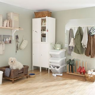 utility room with cupboard and wooden flooring