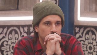 Vince with his hands folded